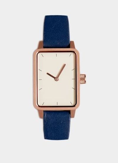 <a href="https://simplewatch.co/collections/womens-collection/products/3-watch-gold-navy-32mm" target="_blank">Simple No 3 Watch in Gold and Navy, $249.</a>