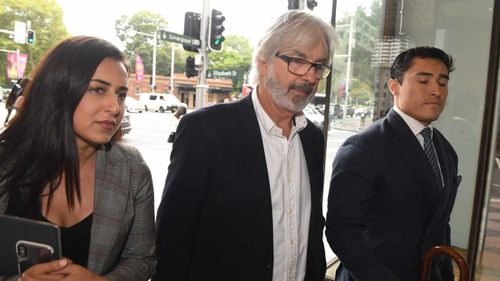 John Jarratt (centre) arrives at court.