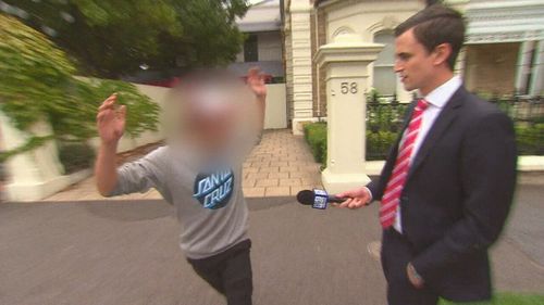 The boy today lashed out at 9NEWS on the streets of North Adelaide, after he was released on bail. (9NEWS)