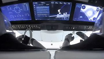 In this image from video provided by NASA, astronauts in the SpaceX Dragon capsule prepare for undocking from the International Space Station.