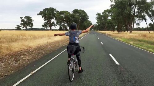 Riding with no hands is illegal Australia-wide.