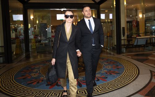 Jarryd Hayne with his wife, walking out of Downing Centre Courts after a guilty verdict.