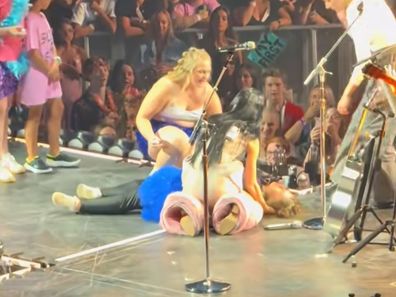 Katy Perry tends to fan onstage