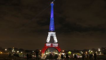 <p>The Eiffel Tower in Paris has been lit up in the national colours of blue, white, and red in honour of the victims lost in Friday's terror attacks, the first time the iconic monument has been illuminated in the colours since the tragedy. (AAP)</p>