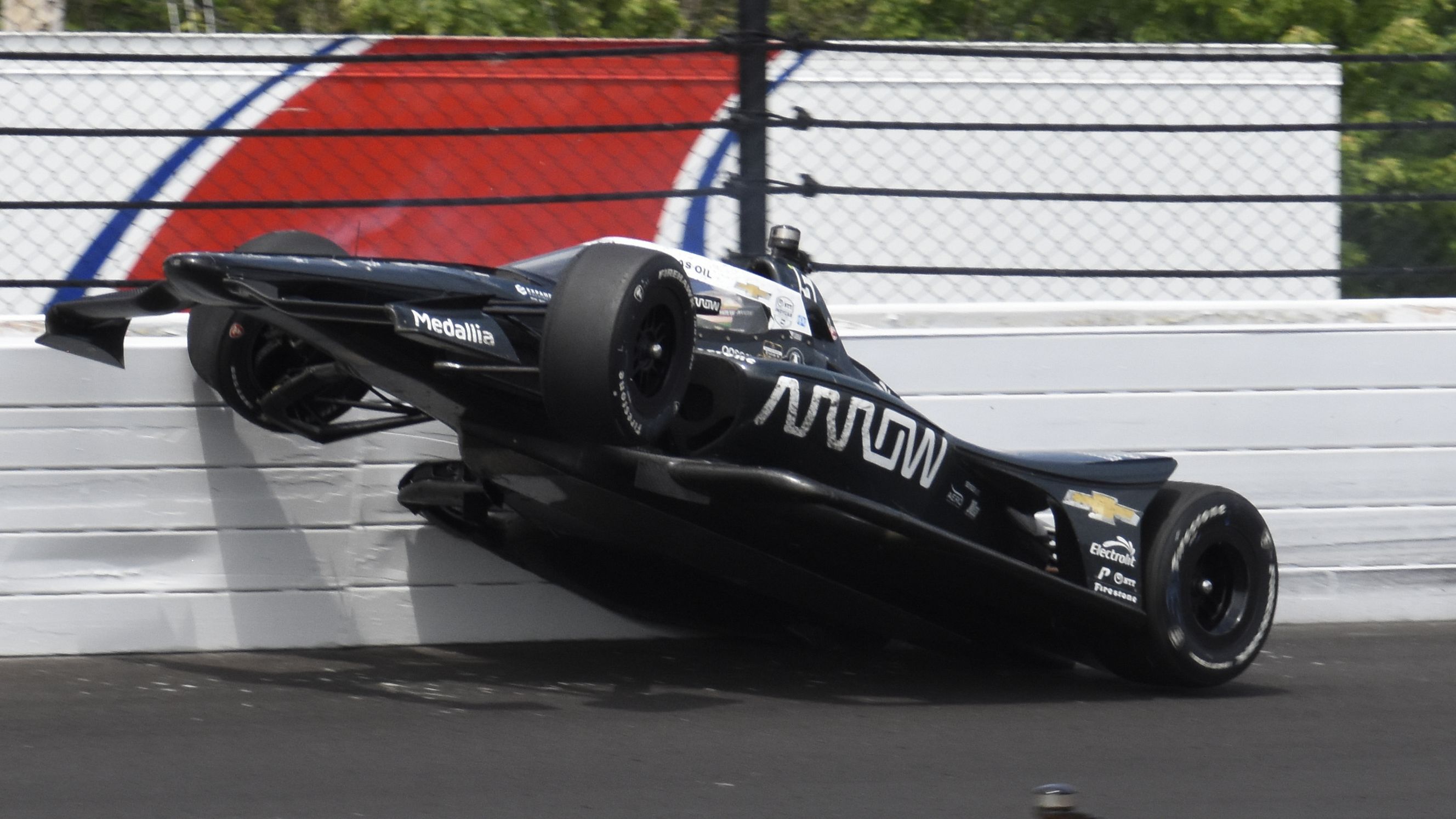 Pato O&#x27;Ward hits the wall in the third turn during the Indianapolis 500.