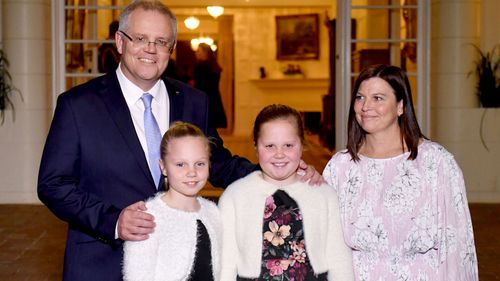 Mr Morrison and his family at Government House last night. 