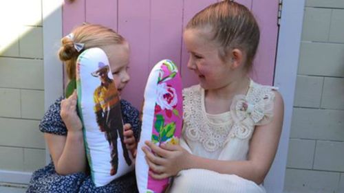 Andie and Lily Martin with their Wish U Were Here dolls made by their mother Lauren. (Supplied)