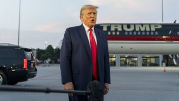 Former President Donald Trump speaks with reporters before departure from Hartsfield-Jackson Atlanta International Airport, Thursday, Aug. 24, 2023, in Atlanta. 