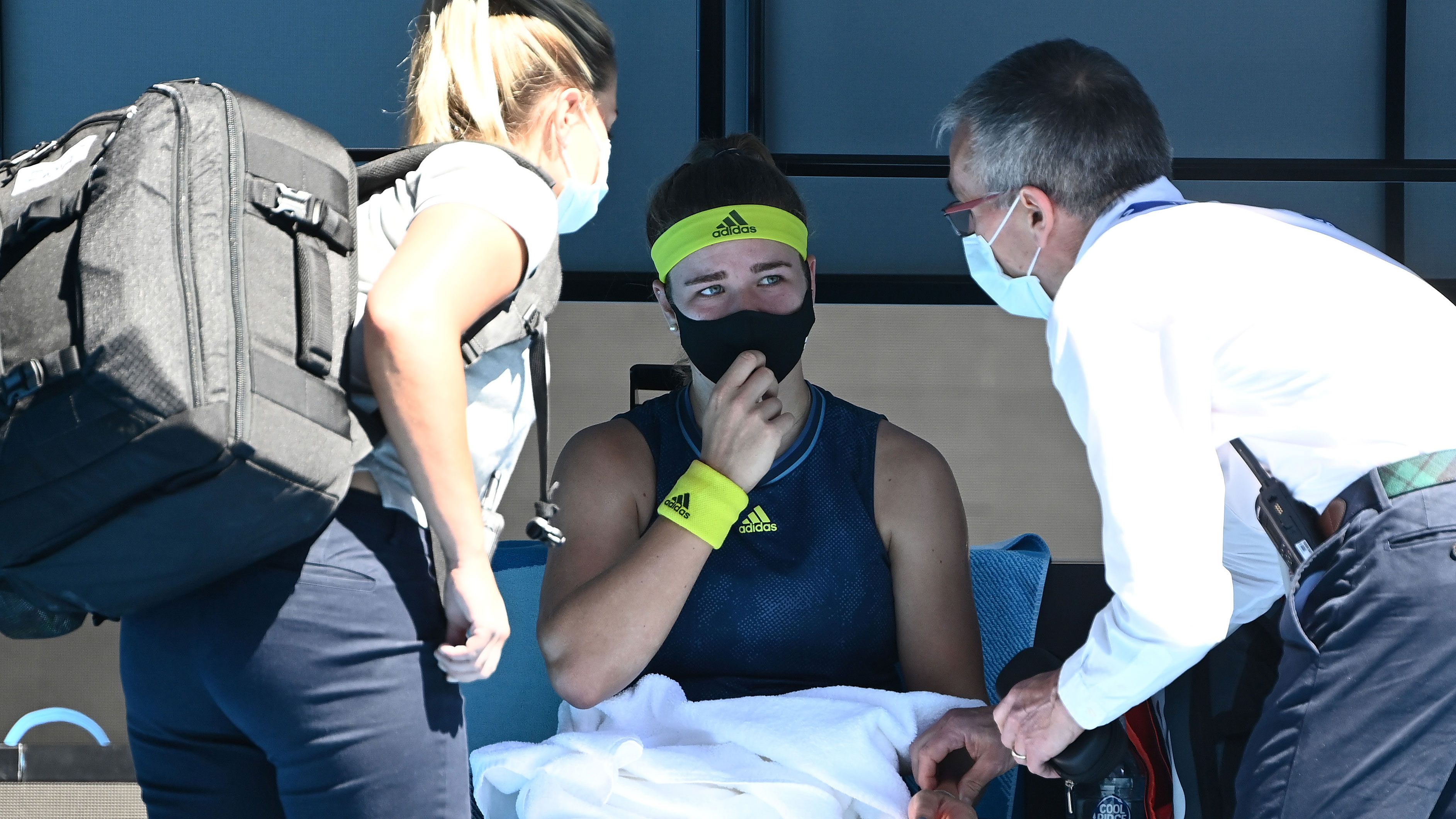 Karolina Muchova is seen to by medical staff during her match against Ash Barty.