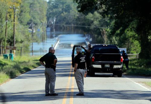 Sheriff's deputies at the scene where two women died while being transported in a police van in South Carolina.