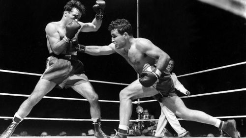 Jake LaMotta, right, fights Marcel Cerdan in Briggs Stadium in Detroit in 1949. 