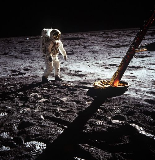 Astronaut Buzz Aldrin walks on the moon.