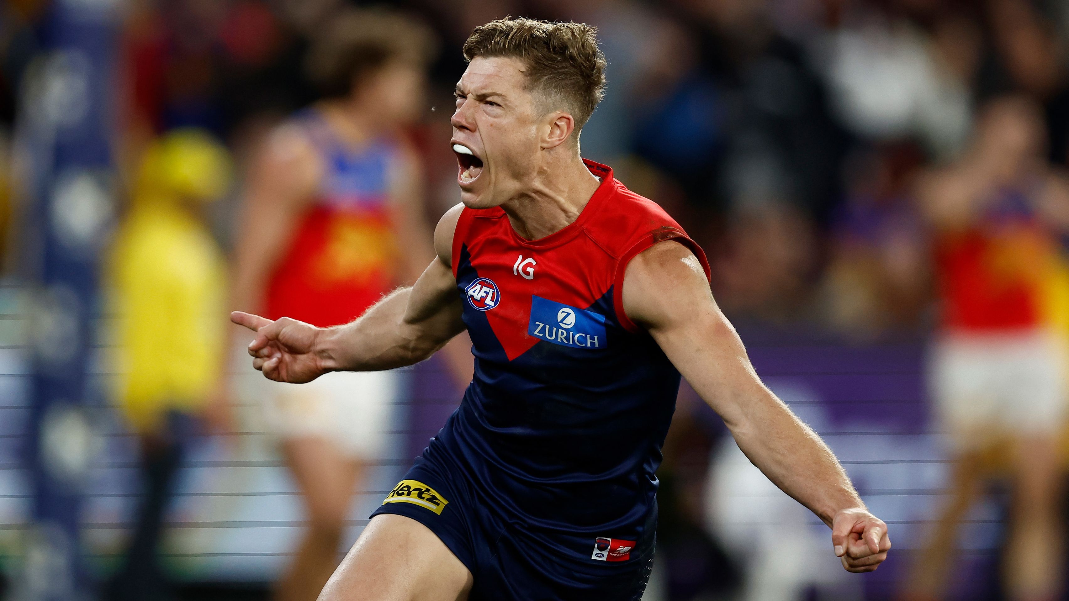 MELBOURNE, AUSTRALIA - JULY 14: Jake Melksham of the Demons celebrates a goal during the 2023 AFL Round 18 match between the Melbourne Demons and the Brisbane Lions at the Melbourne Cricket Ground on July 14, 2023 in Melbourne, Australia. (Photo by Michael Willson/AFL Photos via Getty Images)