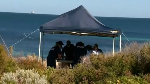 Police pictured at the iconic Perth beach today.
