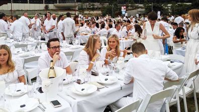 The crowd dressed up all in in white for the annual white picnic, Diner en Blanc 