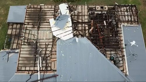 Drone footage shows the devastation the freak storm wrought on houses at Mount Mitchell.