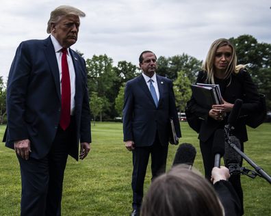 Trump, Health and Human Services Secretary Alex Azar, and White House press secretary Kayleigh McEnany, stop and talk to reporters on May 14, 2020.