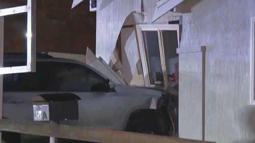 Car crashes into side of Guildford home where woman was sleeping.