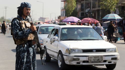 Taliban fighter stand guards in the city of Kabul, Afghanistan.