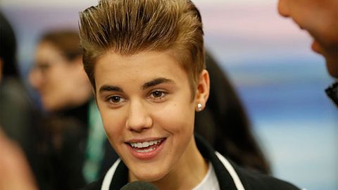 Knocked out cold: Justin Bieber collides with glass for the <i>third time!</i>