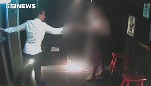 CCTV footage shows Luke Lazarus leading Mullins outside the nightclub. (9NEWS)