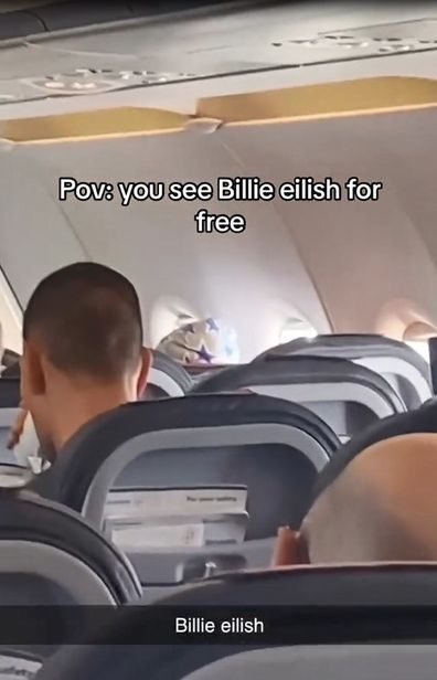 Fan spots Billie Eilish in economy on their flight.