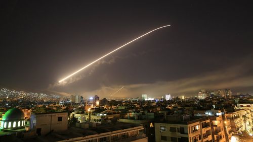 Syrian state media has claimed air defences shot down 13 inbound missiles during the US-led airstrikes today. (AAP)