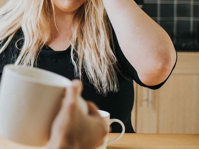 Couple fighting over coffee at home