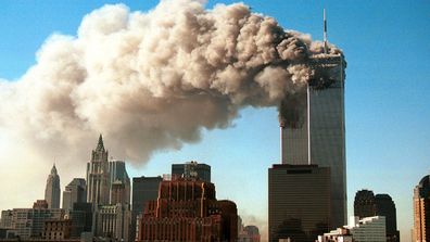  Smoke pours from the World Trade Center after it was hit by two hijacjked passenger planes September 11, 2001 in New York City.