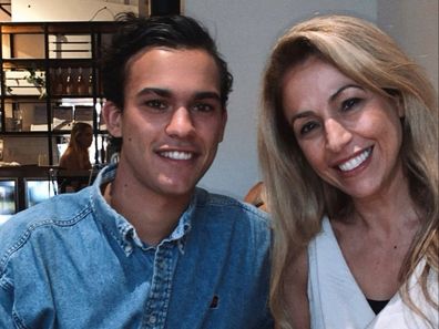 Thomas Burns poses for a photo with his mum.