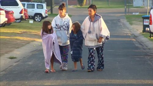 A devastated family returns home after being forced to evacuate. Picture: 9News