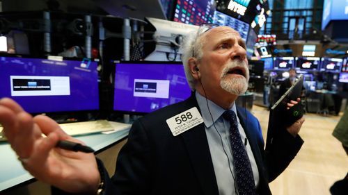 Trader peter Tuchman on the floor of the New York Stock Exchange, where the Dow Jones has been hammered over the past week.