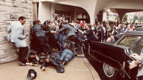 Hinckley attempted to assassinate US President Ronald Reagan outside a hotel in Washington in 1981. (Getty)