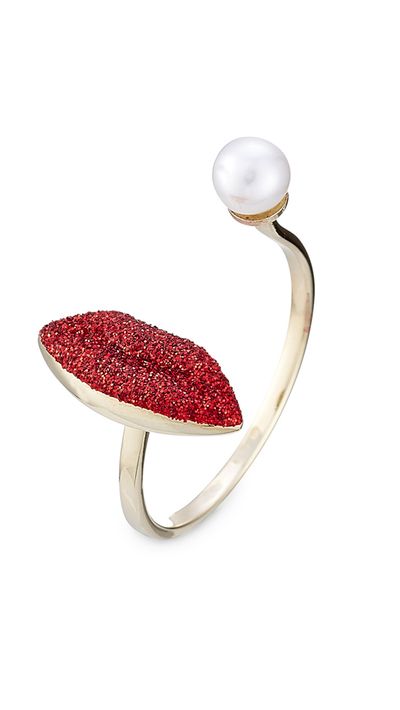 <p><a href="http://www.stylebop.com/au/product_details.php?id=610498" target="_blank">9kt White Gold Ring with Glitter Enamel Lips and Pearl, $458, Delfina Delettrez</a></p>