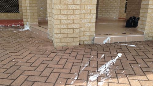 White paint was splashed on paving in front of the Perth mosque. (9NEWS)