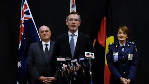 NSW Premier Dominic Perrottet (centre) with NSW Police and Emergency Services David Elliott (left) and NSW Police Commissioner Elect Karen Webb (right) during the announcement of her position in NSW Parliament House. Sydney, NSW. 24th November, 2021. Photo: Kate Geraghty