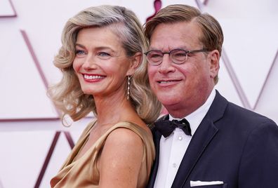 Paulina Porizkova, left, and Aaron Sorkin arrive at the Oscars on Sunday, April 25, 2021, at Union Station in Los Angeles. (AP Photo/Chris Pizzello, Pool)