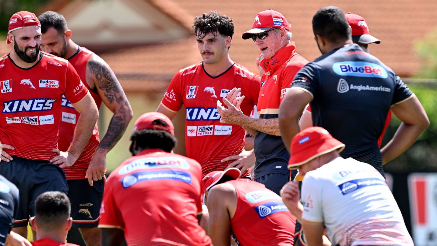 Wayne Bennett lays down the law to Dolphins players at a training session.