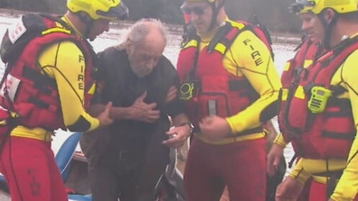 Queensland floods hero tradies save elderly man trapped in waters