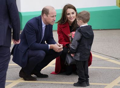 Prince William and Kate, Princess of Wales, receive a posy of flowers as they arrive for a visit to the RNLI Holyhead Lifeboat Station, in Holyhead, Wales, where they are meeting crew, volunteers and some of those who have been supported by their local unit, Tuesday September 27, 2022.