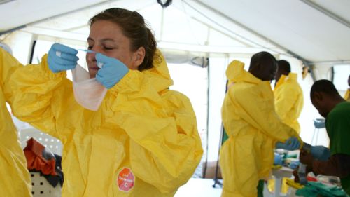 Medecins Sans Frontieres nurses put on personal protective equipment. (Getty Images)
