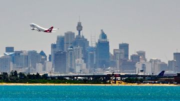 A Qantas plane takes off from Sydney Airport.