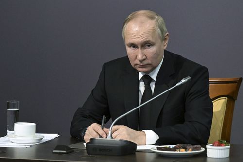 Russian President Vladimir Putin speaks during his meeting with WWII veterans and representatives of patriotic civil society associations at the State Memorial Museum of the Defense and Siege of Leningrad in St. Petersburg, Russia, Wednesday, Jan. 18, 2023 