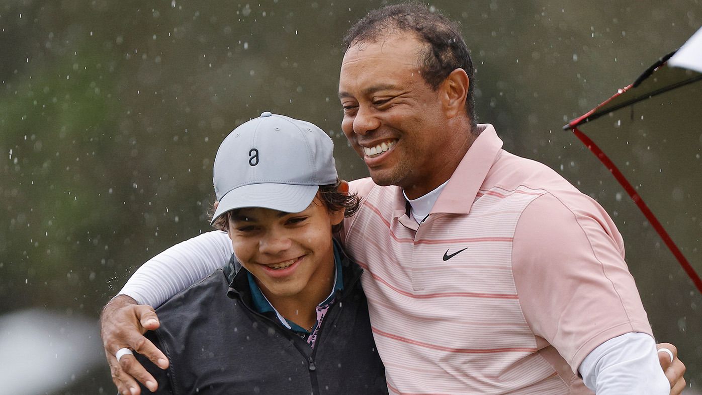 Tiger Woods of the United States embraces son Charlie Woods on the 18th green during the first round of the PNC Championship at The Ritz-Carlton Golf Club on December 16, 2023 in Orlando, Florida. (Photo by Mike Mulholland/Getty Images)