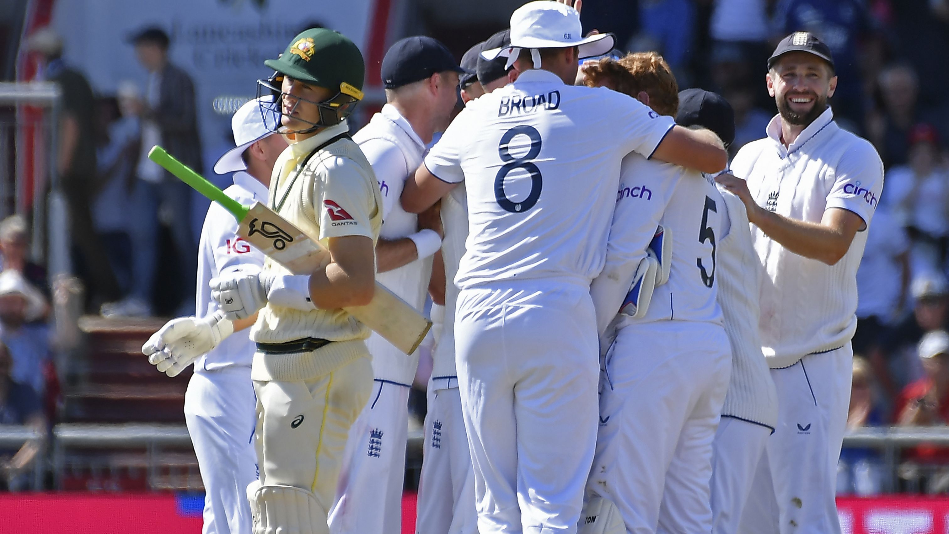 Australia&#x27;s Marnus Labuschagne reacts as England players celebrate his dismissal.