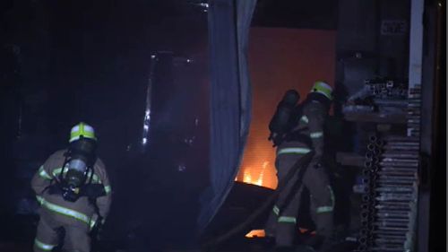 Fire tears through Melbourne factory stocked with wooden pallets 