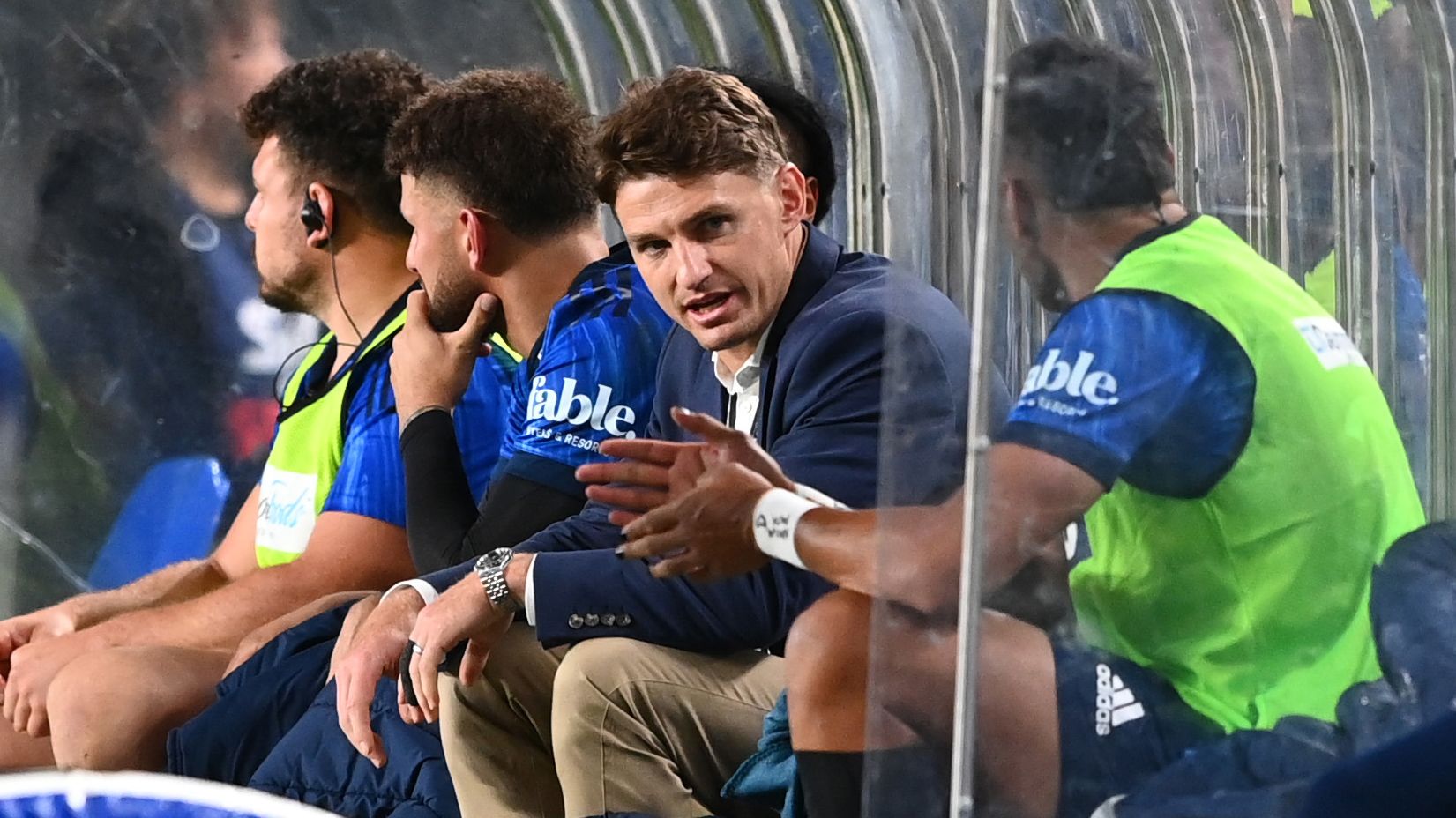Injured Beauden Barrett sits ob the bench during the Super Rugby Pacific match between the Blues and Moana Pasifika at Eden Park.