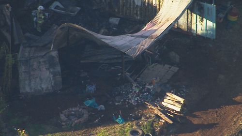 Two dead after caravan fire in Upper Brookfield near Brisbane.