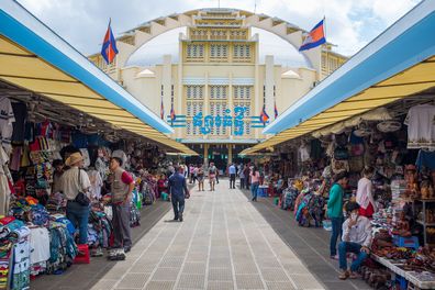 Phnom Penh, Cambodia - August 17, 2016: Shoppers and market vendors at the central market in Phnom Penh. The Central Market in the Cambodian capital was constructed in 1937 in the shape of a dome with four arms branching out into hallways.