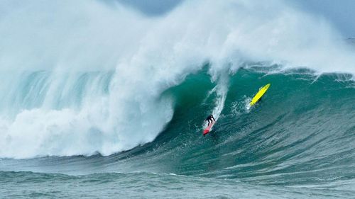 Photographer Lozzapix captured this incredible image as surfer Lachy Lemarseny drops into a monster wave at Wedding Cake Island, off Coogee in Sydney.